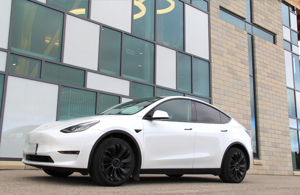 Pearl White Tesla Model Y with Tesloid Wheel Covers