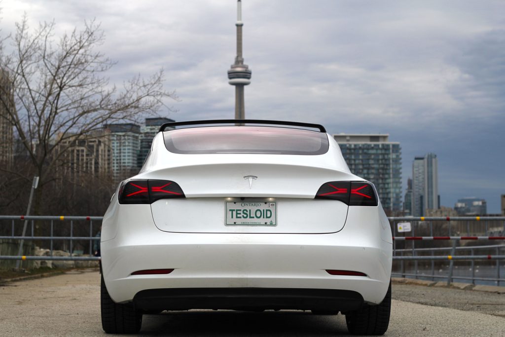 Rear Side of a Pearl White Tesla Model 3