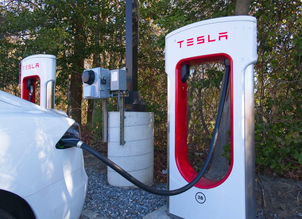 Tesla Vehicle Charging at a Tesla Supercharging Station