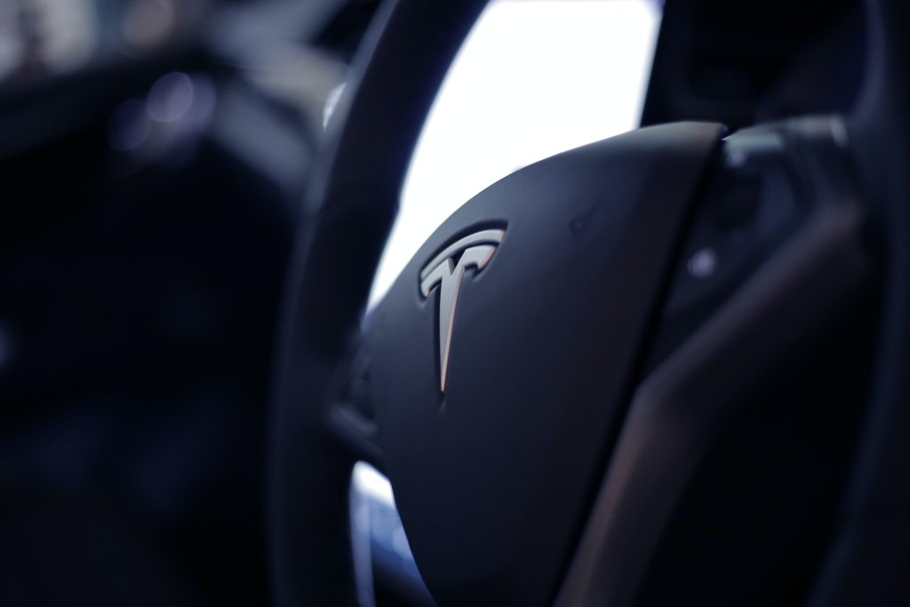 Tesla Round Steering Wheel, that can be configured to sport mode.