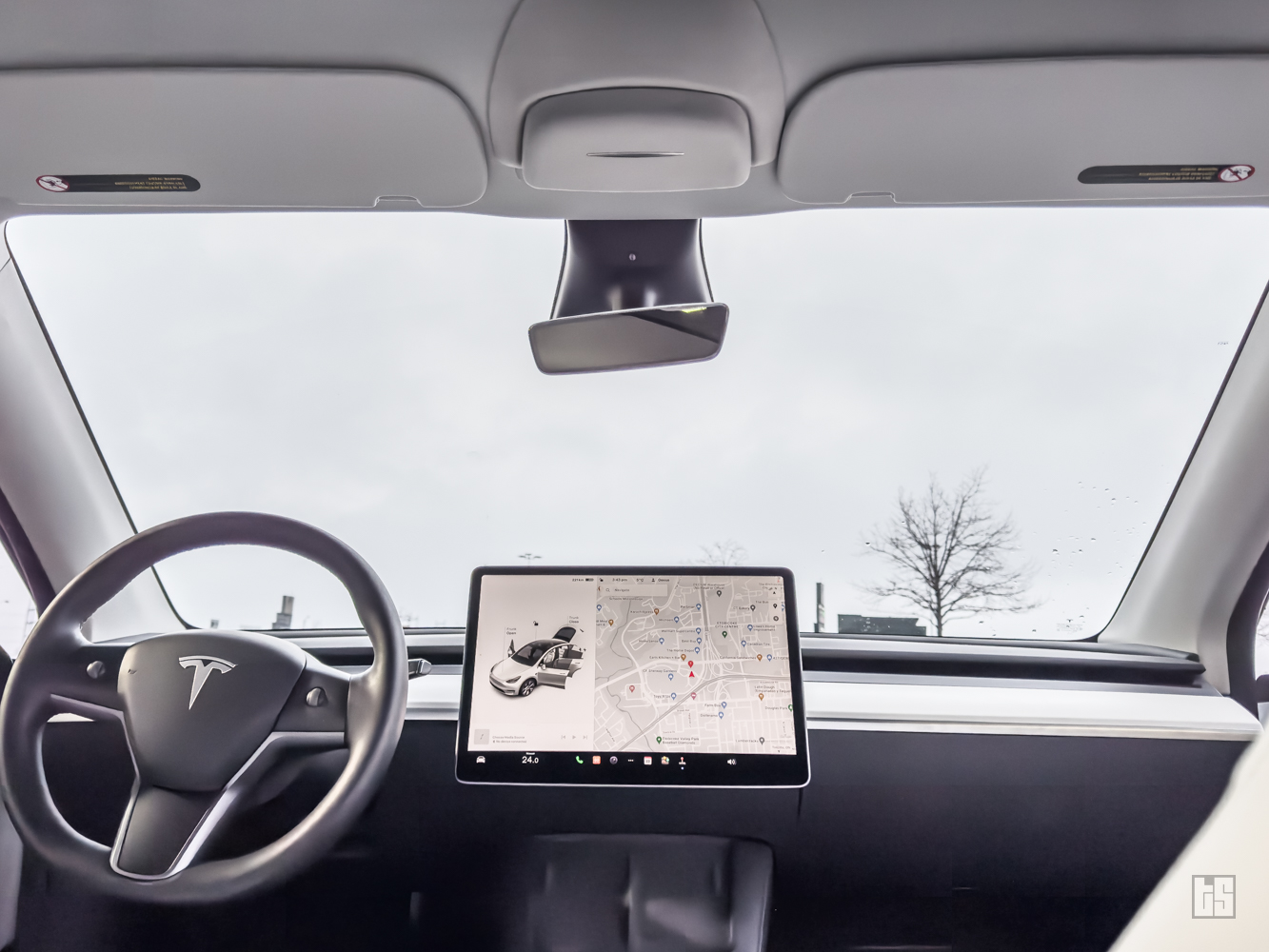 Interior of a Tesla with Tesloid Accessories such as the Sunglasses Holder and Dashboard Wrap