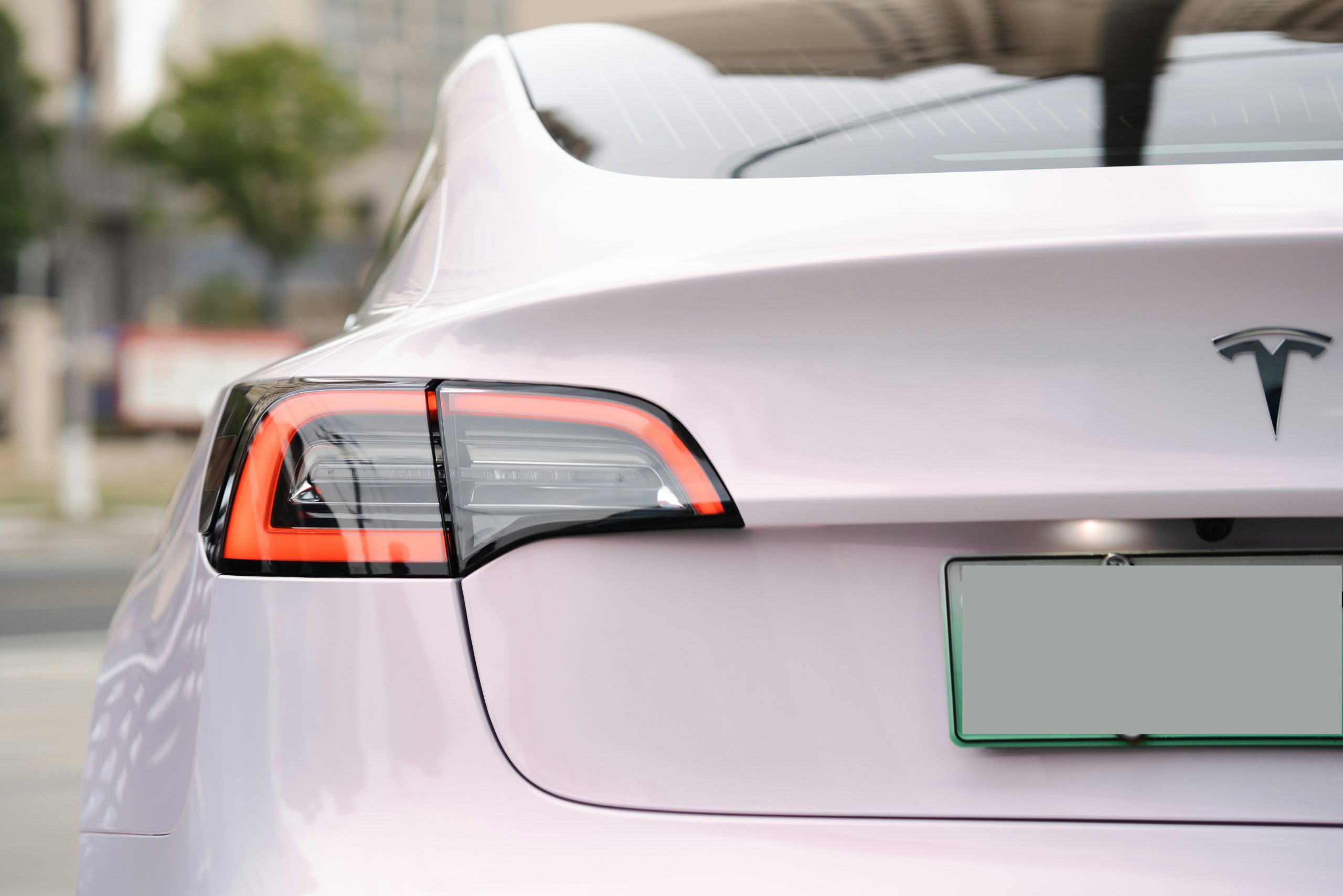 Rear Side of a Pearl White Tesla Model 3