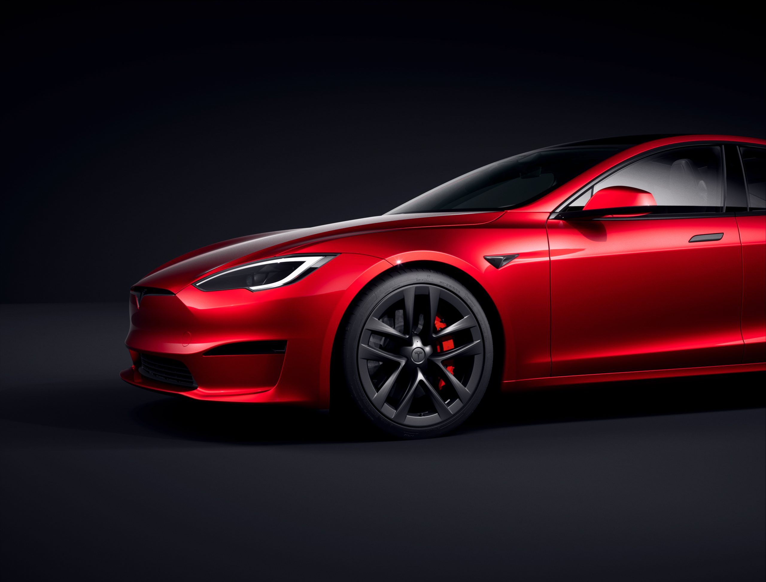 Red Tesla Model S With the Door Handle Showing