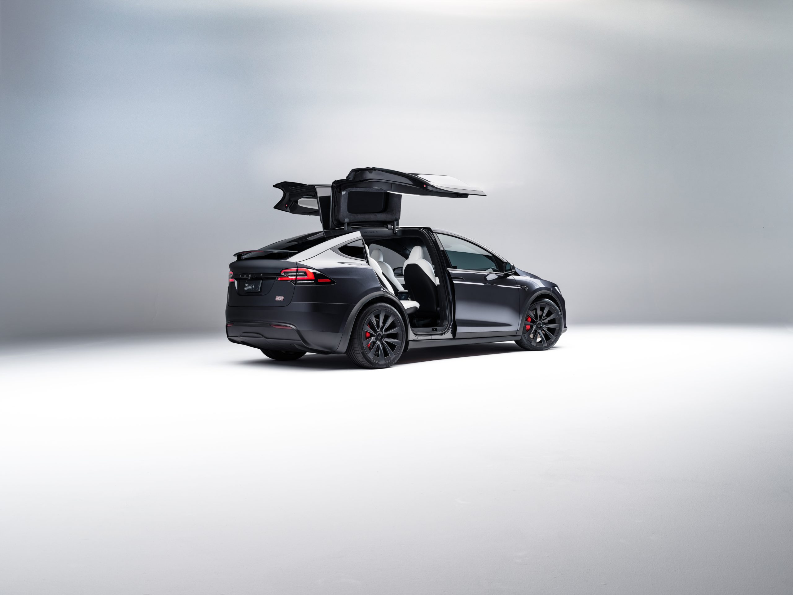 Solid Black Tesla Model X with the Falcon Wing Doors Open