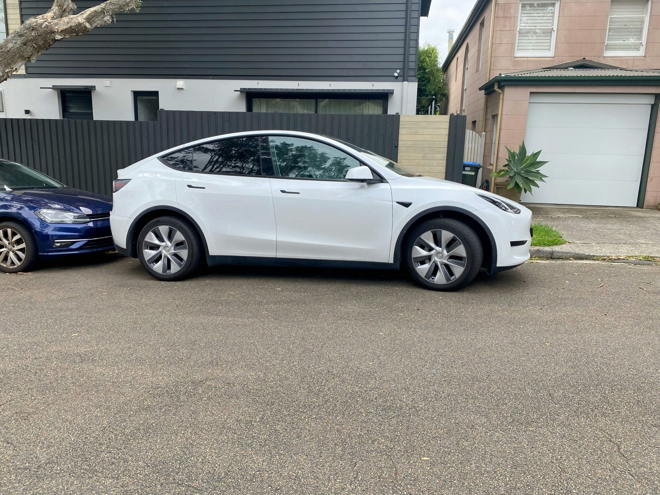 Pearl White Tesla Model Y Parked